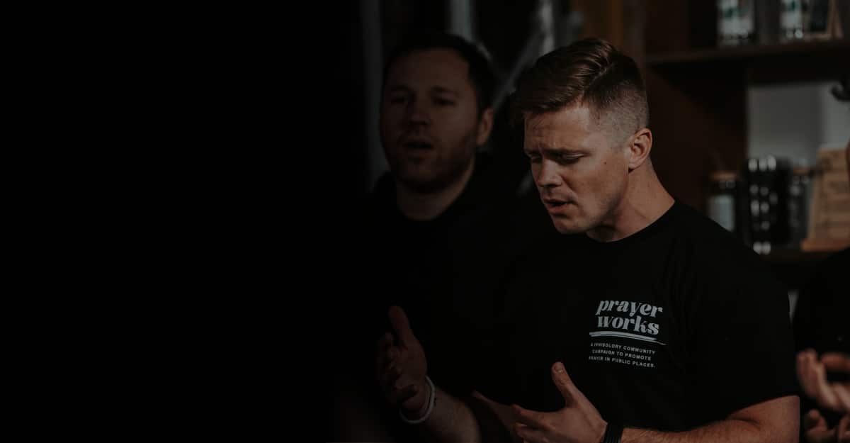 Two men praying together