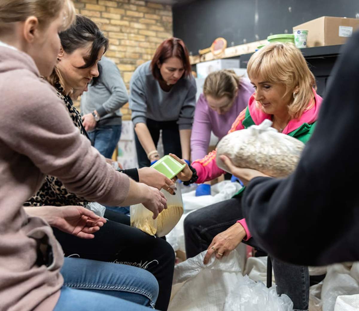 Volunteers packing food together